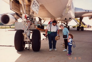 6 0y8. Mike Bird, Gloria Rosenberg, and Antonia under a 747