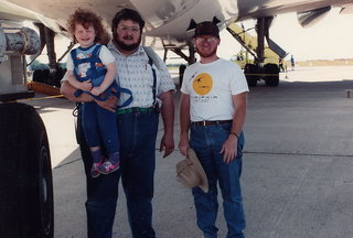 8 0y8. Antonia, Mike Bird, and Adam under a big airplane