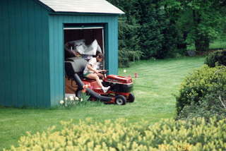 Sally Wright mowing the lawn