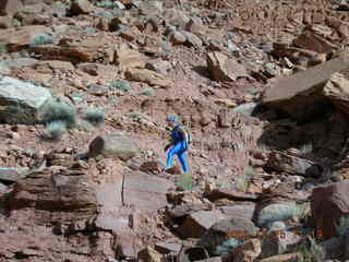 Canyonlands -- Lathrop Trail -- Adam hiking uphill