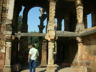 119 69h. Qutub Minar, Delhi - Hitesh amid two-story columns