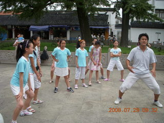 57 6kv. eclipse - Shanghai - Zhu Jia Jiao village - girls joining us for Tai Chi