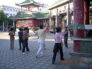 69 6l1. eclipse - Jiuquan morning run - Tai Chi people