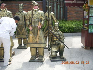226 6l3. eclipse - Xi'an - Terra Cotta warriors - Adam getting out of warrior costume