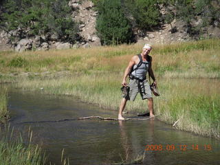 Dustin crossing the river - hiking at Pine Valley, Utah