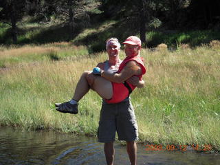 Dustin carrying Marcelle hiking at Pine Valley, Utah