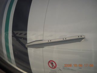reflection of Alaska Air 737 in jet nacelle