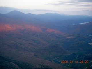 aerial - mountains near Red Creek with strip of sun