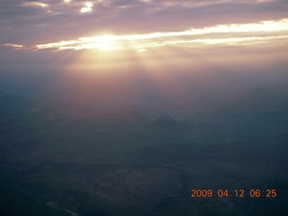 aerial - mountains near Red Creek with rays of sun