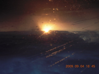 Blythe (BLH) fly-in - sunset through storm clouds - inverted for phony sunrise