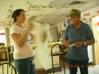 Alamo Lake airstrip - Wayside Inn - Nancy giving Carl t-shirt