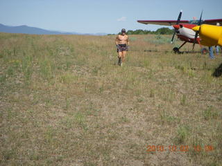 Adam running at Me-Own airstrip with airplanes around