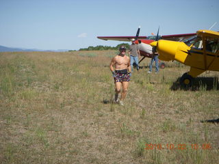 Adam running at Me-Own airstrip with airplanes around