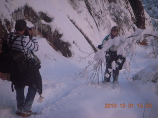 77 7ex. Zion National Park trip - Hidden Canyon hike - Luiz taking a picture of Sheri