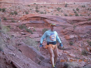 36 7qb. Canyonlands National Park - Lathrop trail hike - Adam hiking (tripod)