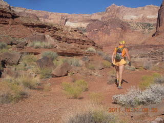 59 7qb. Canyonlands National Park - Lathrop trail hike - Adam hiking - back (tripod)