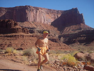 79 7qb. Canyonlands National Park - Lathrop trail hike - Adam running (tripod)