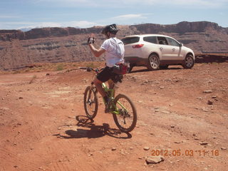 178 7x3. Harrah Pass drive back - mountain biker - my Chevrolet Transverse rental car at the pass