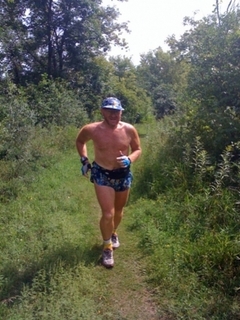 Adam running in the forest in Germany