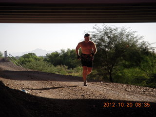 Adam running at Windmill airstrip (tripod, back)