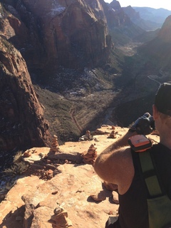 220 8gt. Zion National Park - Angels Landing hike - Adam taking a picture of the ledge at the top