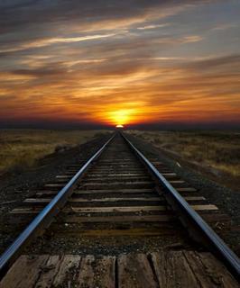 sunset over the railroad tracks