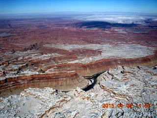 39 8v2. aerial - snow and clouds and canyon - Confluence of Green and Colorado Rivers