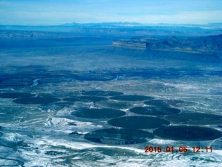 82 8v5. aerial - snowy canyonlands - crop irrigation circles