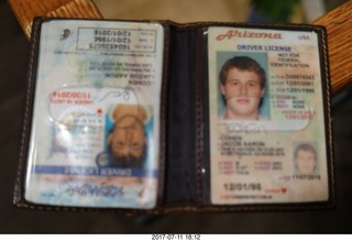 two drivers licenses, somebody's wallet left on the stairs