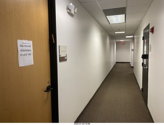 hallway with we-moved-downstairs sign