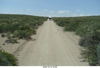 248 a0y. Argentina Eclipse Day - driving back to Neuquen - other bus driving backwards
