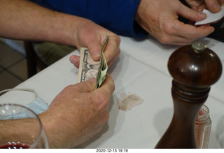 152 a0y. Argentina - Buenos Aires - counting the money for the bill