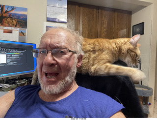 Adam with my cat Devin on my lap