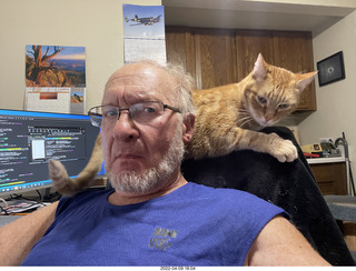 Adam with my cat Devin on my lap