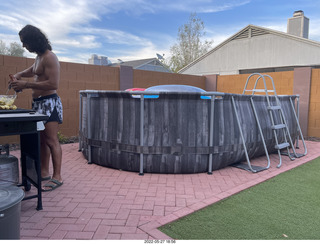 Anthony at the barbecue and the pool