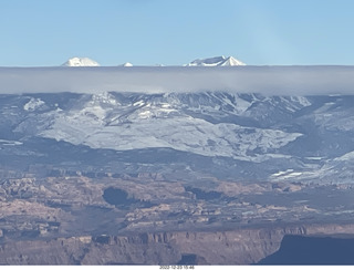 314 a1n. aerial - canyonlands - back to canyonlands field (cny) - clouds on Lasalle Mountains