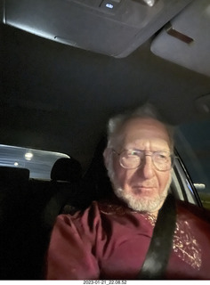 Adam with cat Jane on the chair