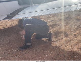 140 a20. Dirty Devil airstrip - digging dirt to turn airplane around