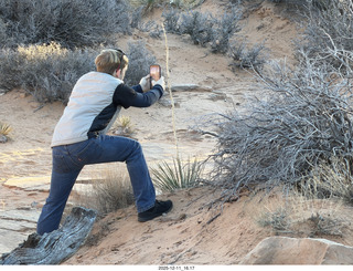 455 a2q. Utah - Canyonlands National Park - Mesa Arch hike - Tyler taking a picture