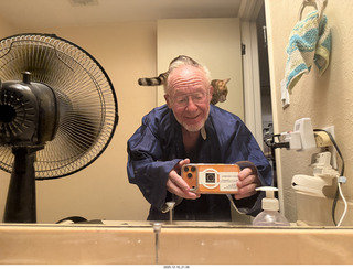 cat Pickle on my coat rack