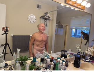 Adam nearly nude with my new bathroom mirror clock