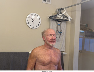 Adam shirtless with my new bathroom mirror clock