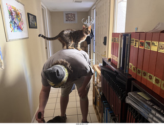 Noah and cat Pickle on his shoulders