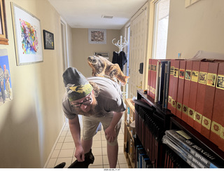 Noah and cat Pickle on his shoulders