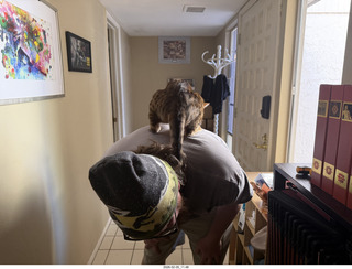 Noah and cat Pickle on his shoulders