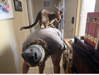 Noah and cat Pickle on his shoulders